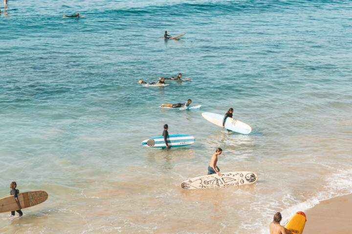 Surfers with longboards