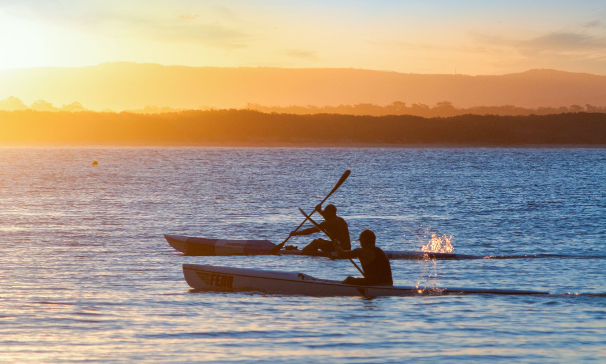 man on noosa river in boat