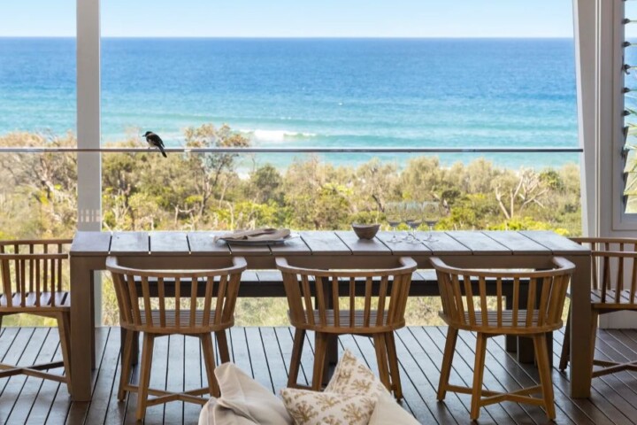 Private balcony with ocean view at a Noosa holiday rental