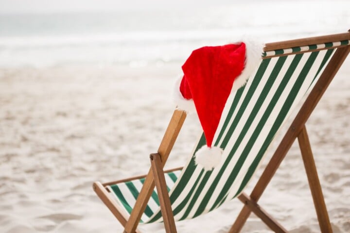 santa hat on a beach chair at noosa beach during christmas