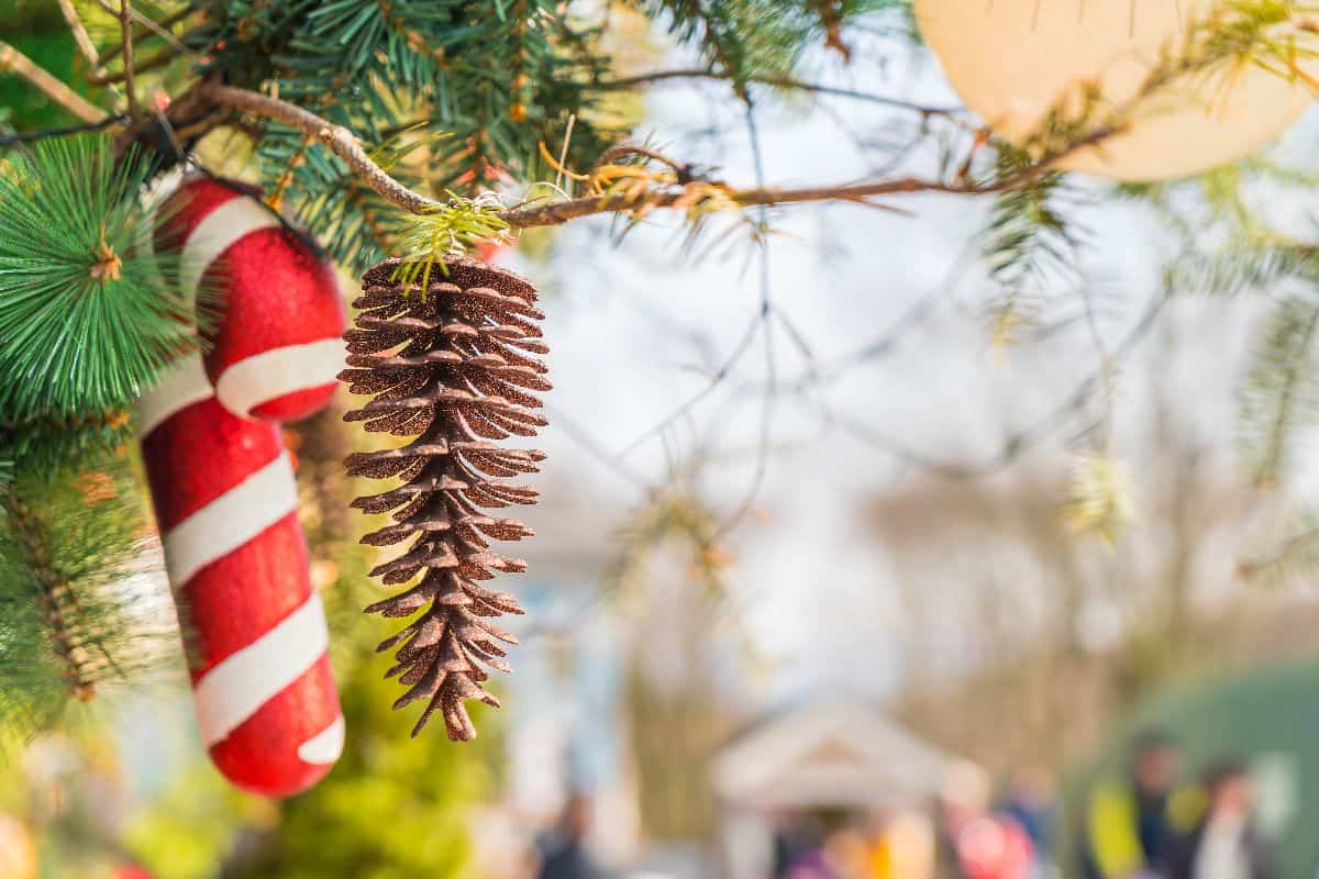 christmas decorations on a pine branch at a festive outdoor market