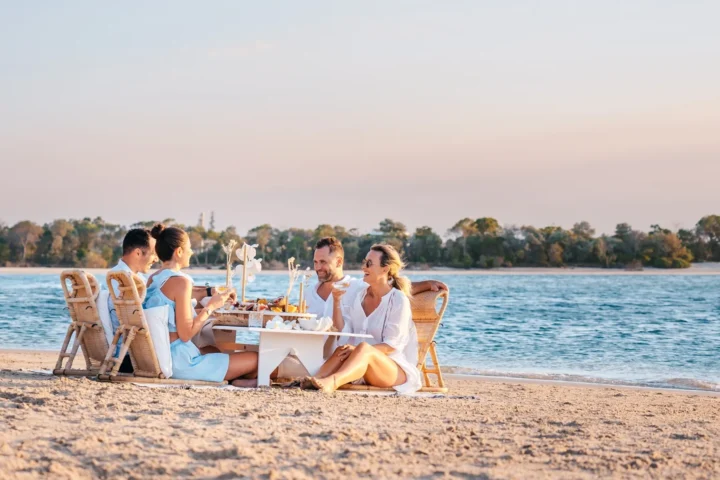 people on the beach in noosa winter